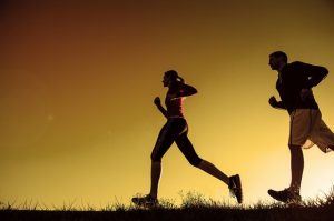 man and woman jogging