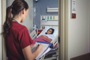 nurse checking on patient