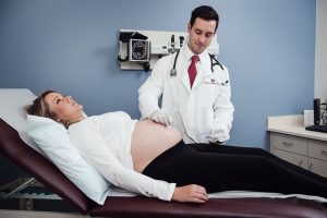 Pregnant woman with her doctor