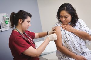 Doctor treating patient