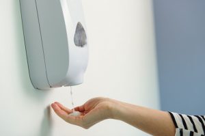 Person sanitizing their hands