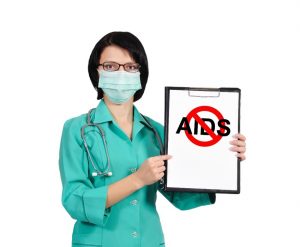 Nurse holding a sign that says NO AIDS