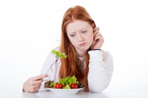 Girl eating salad