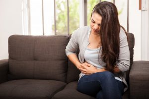 Woman experiencing stomach pain