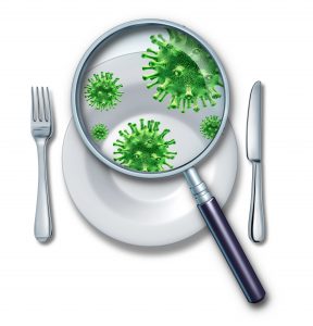 Magnifying glass examining germs on plate