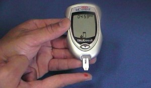 Person using glucose monitor