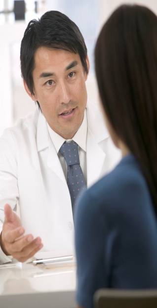 Exceptional Times/Man in Lab Coat Talking to Woman