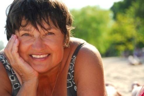 Daily Self Care/Woman Smiling at Beach Photo